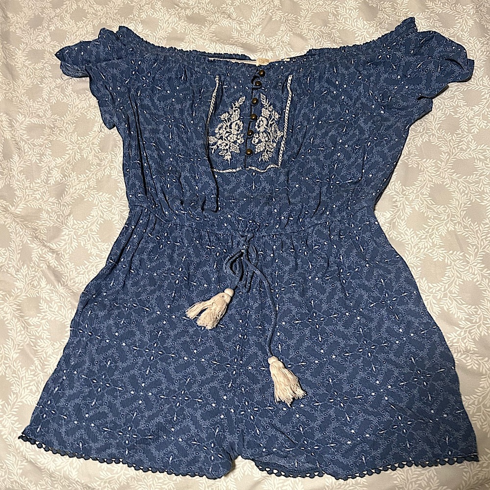 A large blue romper from the brand, Rewind